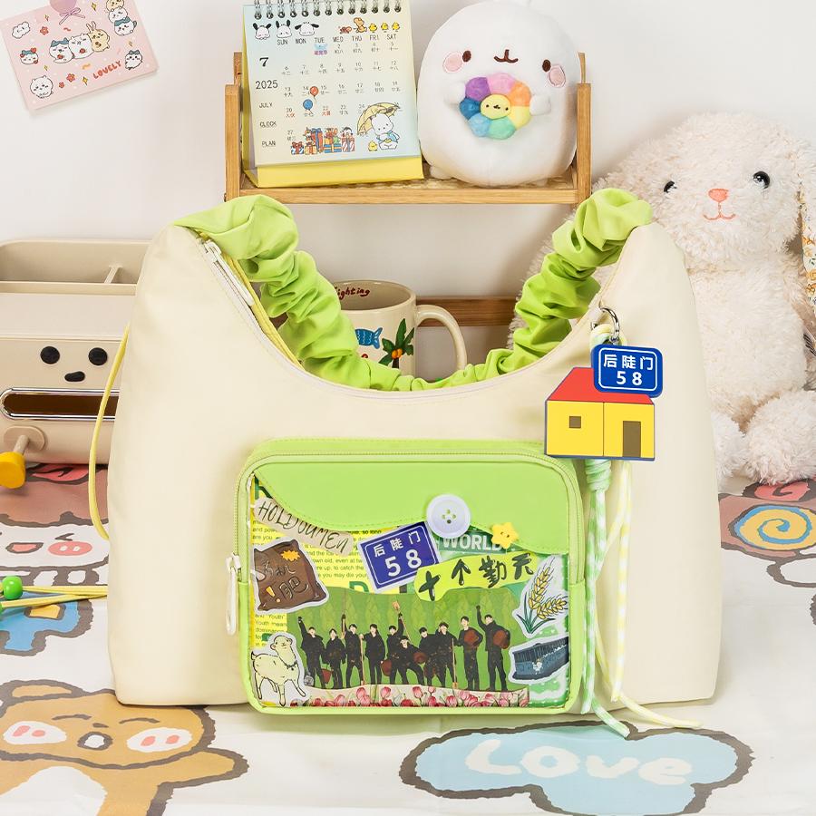 A close-up of a meticulously designed anime-themed bag, showcasing detailed artwork and patches.